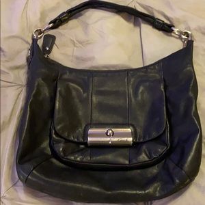 Well loved black coach handbag.  Blue interior.